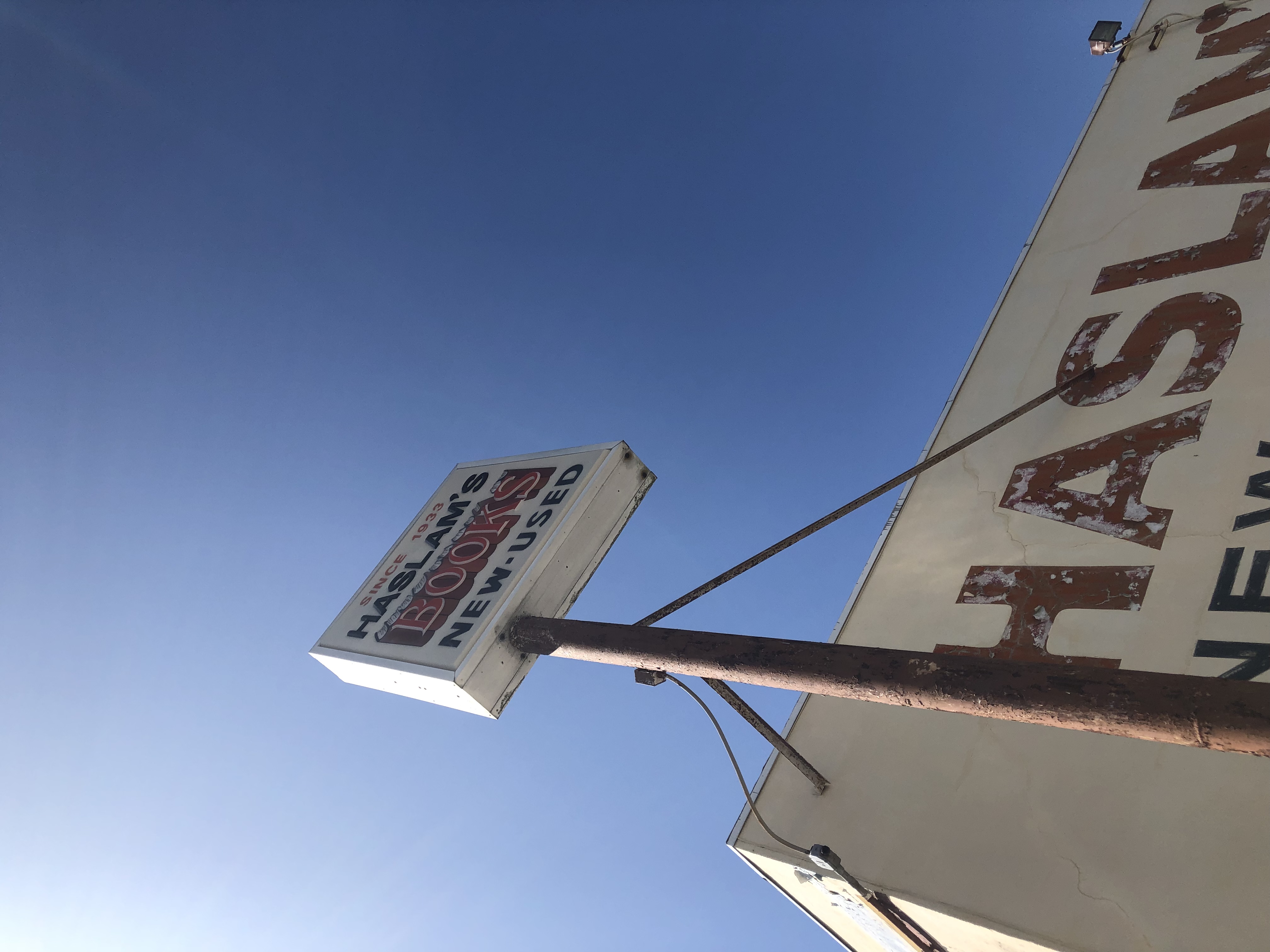 The vintage sign outside of Haslam’s Bookstore reads “Since 1933”