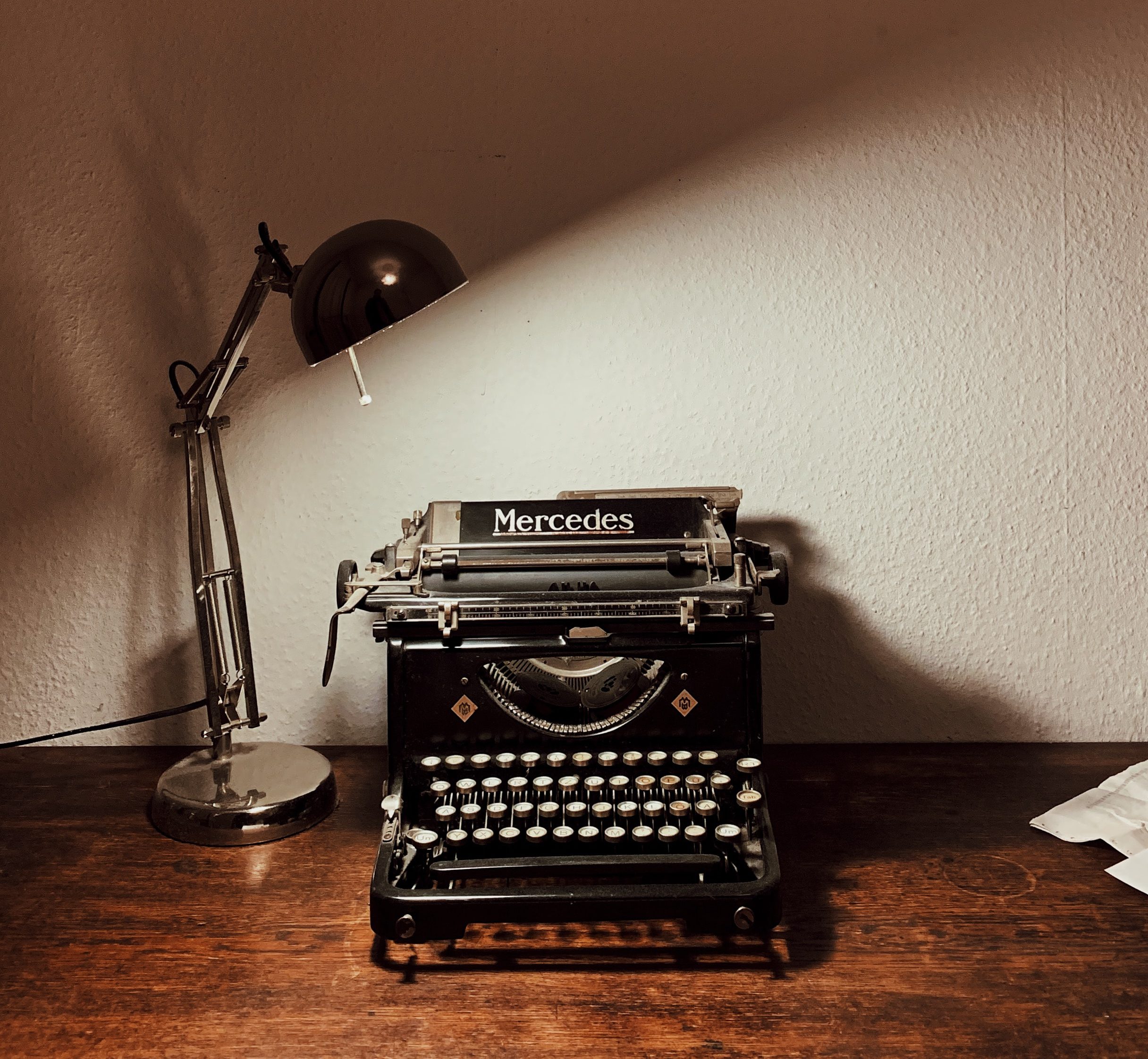 Typewriter with a lamp Courtesy of Unsplash by Yusuf Evli
